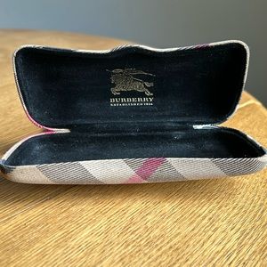 Burberry glass case. Opens/closes perfect. Does have looks like a rust stain